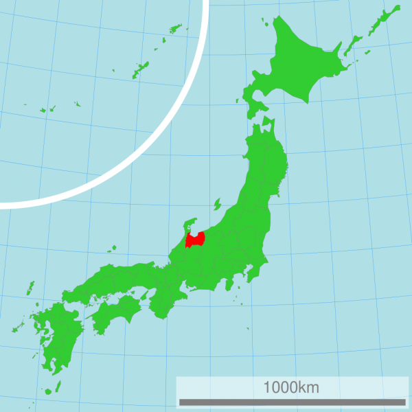 富山と全国の地図を示し、近隣挨拶の土産問題を語る。